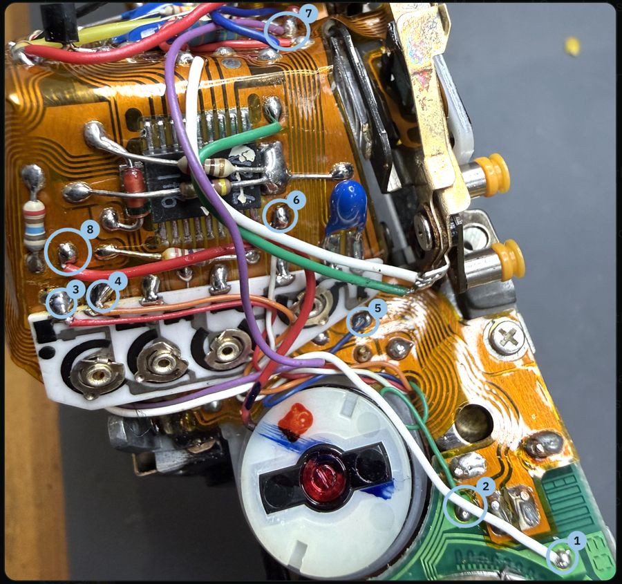 Canon AE-1 flexible circuit with eight solder joints circled and numbered